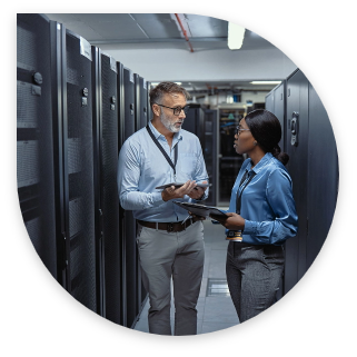 man and woman talking in a data center